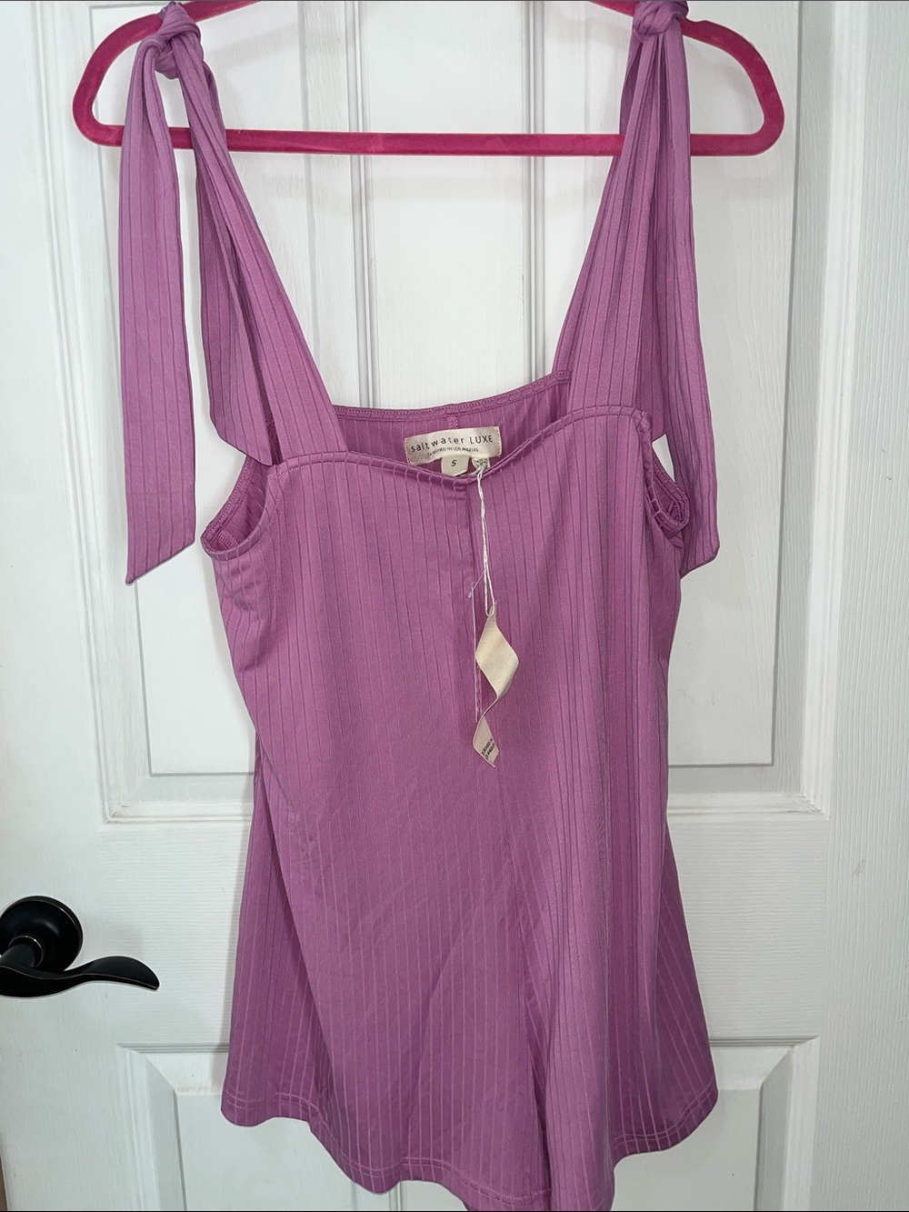 Saltwater Luxe Essential Romper in a mauve or ultra-violet ribbed material.